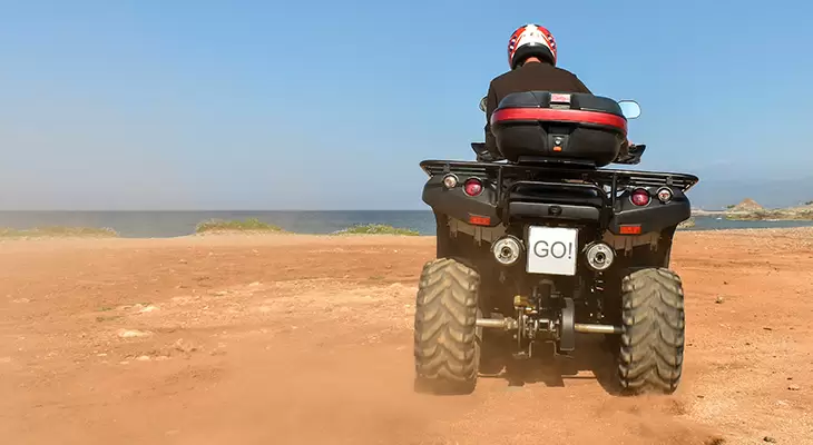 Half an hour riding a quad bikes on the beach