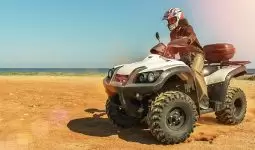 Half an hour riding a quad bikes on the beach